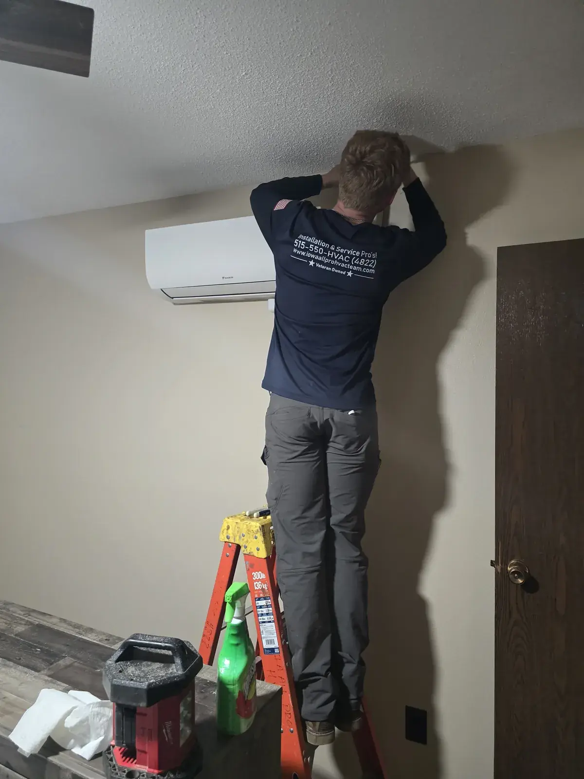 Iowa All Pro technician finishing a ductless mini-split install