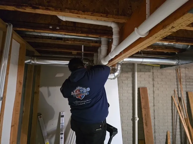 Technician Carlos working on ductwork