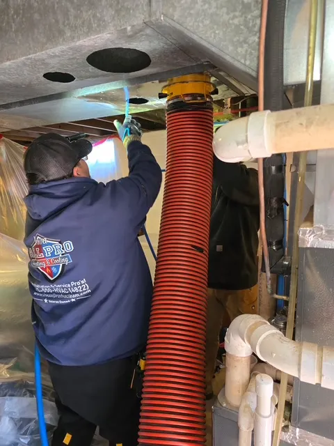 Technician Carlos working on ductwork
