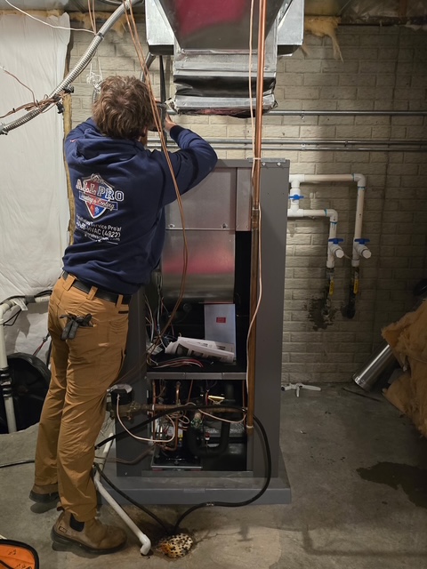 Technician installing new HVAC equipment